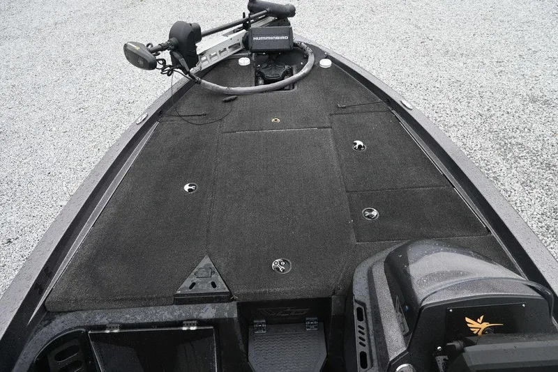 Slide: The Image of 2012 Stratos 189VLO boat deck with trolling motor and storage compartments. - 6