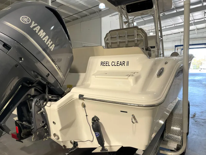 Slide: The Image of 2023 Key West 239 FS boat with Yamaha engine in a garage. - 12