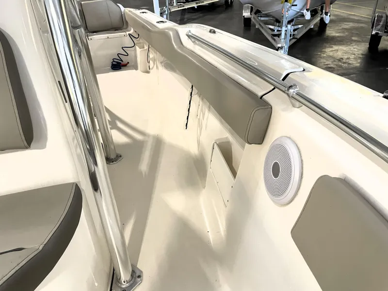 Slide: The Image of 2023 Key West 239 FS boat interior with cushioned seating and speaker. - 26