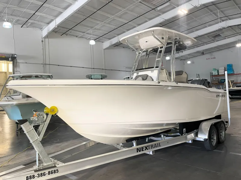 Slide: The Image of 2023 Key West 239 FS boat on trailer in indoor storage facility. - 3