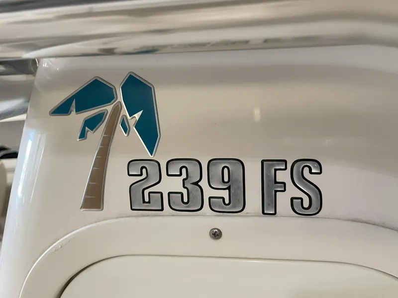 Slide: The Image of Key West 239 FS 2023 boat logo with palm tree design. - 30