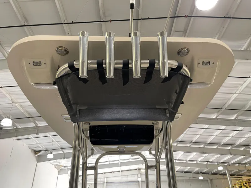 Slide: The Image of 2023 Key West 239 FS boat top view with rod holders in a warehouse setting. - 40