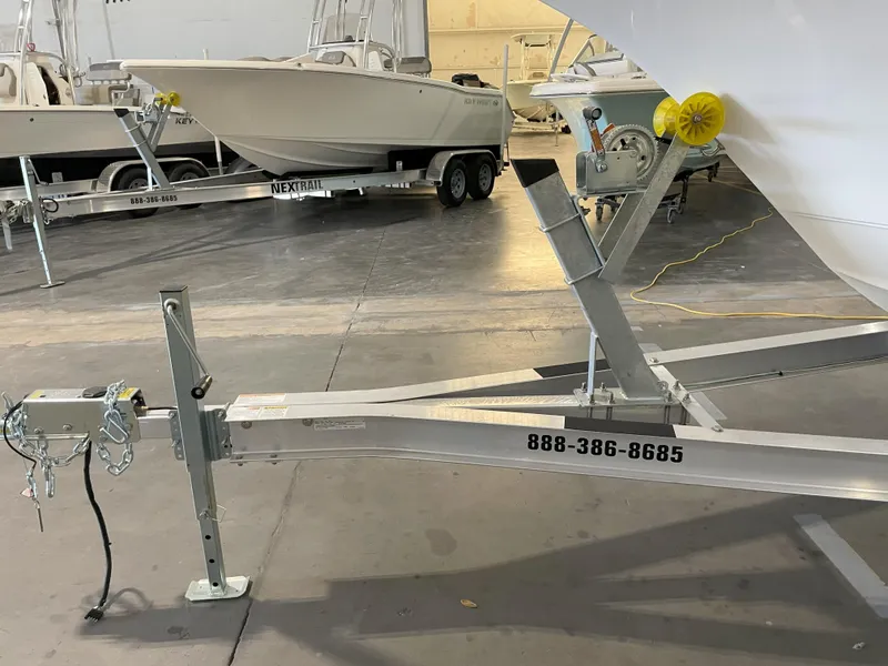 Slide: The Image of 2023 Key West 239 FS boat trailer in a storage facility. - 46