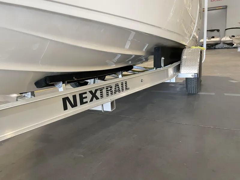 Slide: The Image of 2023 Key West 239 FS boat on NexTrail trailer in a garage. - 47
