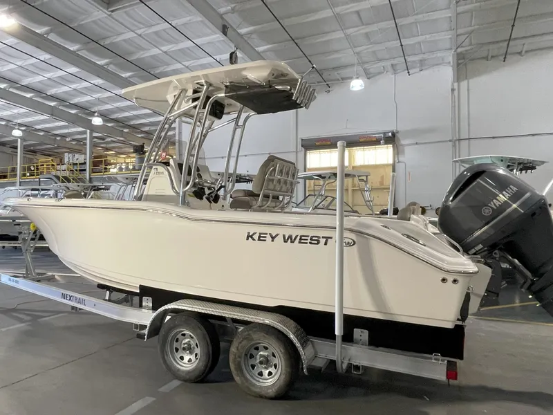 Slide: The Image of 2023 Key West 239 FS boat on trailer in warehouse setting. - 5