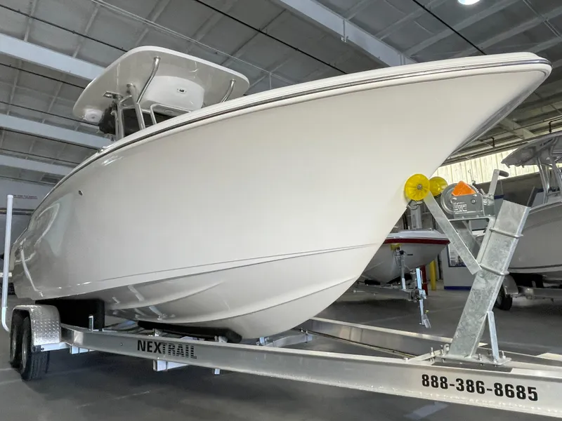 Slide: The Image of 2023 Key West 239 FS boat on trailer in indoor storage facility. - 8