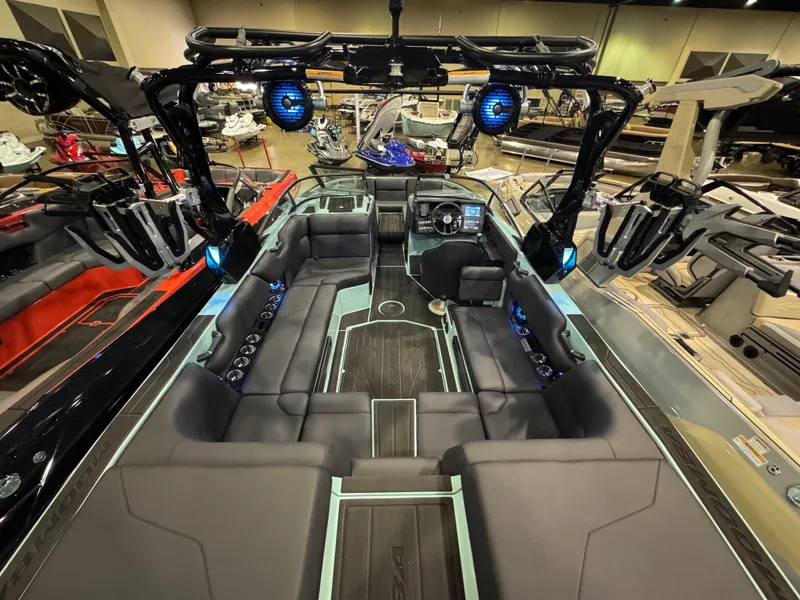 Slide: The Image of 2025 Moomba Max boat interior with sleek seating and advanced audio system. - 18