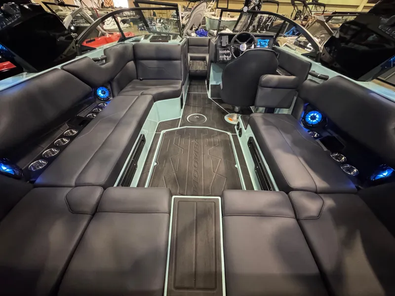 Slide: The Image of 2025 Moomba Max boat interior with sleek seating and modern dashboard design. - 19