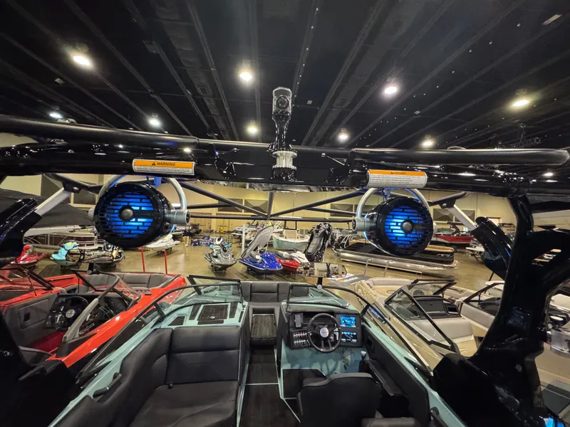 Slide: The Image of 2025 Moomba Max boat interior with advanced audio system and sleek design. - 22