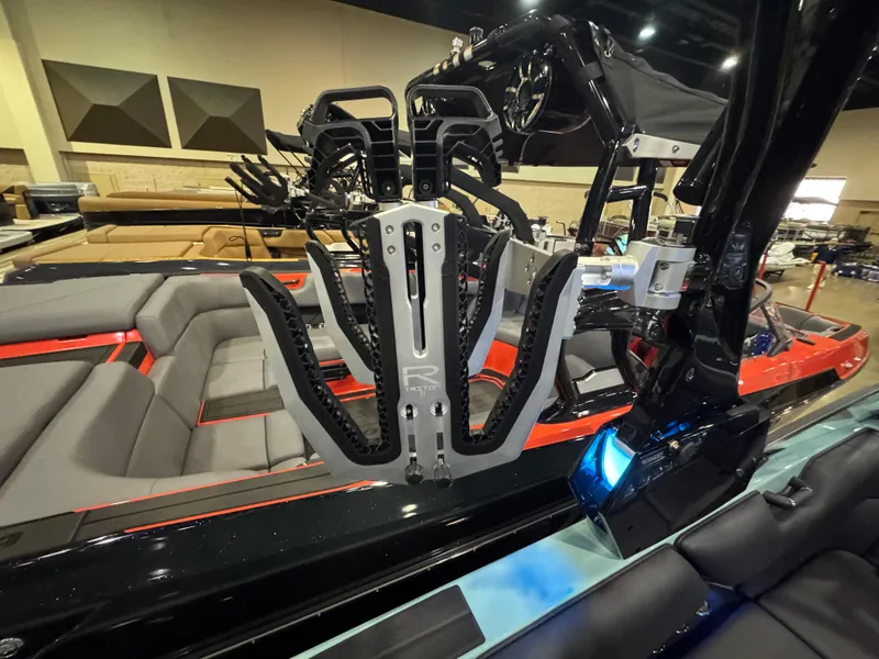 Slide: The Image of 2025 Moomba Max boat interior with advanced wakeboard rack and seating. - 23