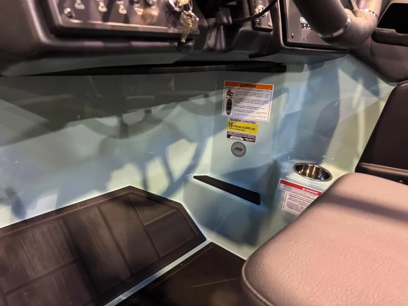 Slide: The Image of Interior view of 2025 Moomba Max boat dashboard with controls and seating. - 29