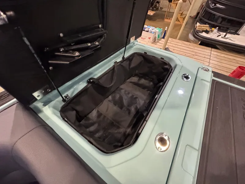 Slide: The Image of 2025 Moomba Max boat storage compartment open, showcasing spacious interior design. - 41