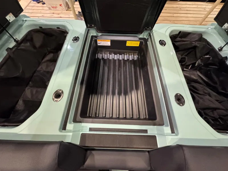 Slide: The Image of 2025 Moomba Max boat storage compartments with open hatches, showcasing spacious interior design. - 43