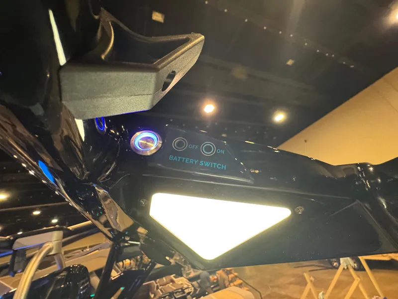 Slide: The Image of 2025 Moomba Max boat battery switch with illuminated controls in a showroom setting. - 46