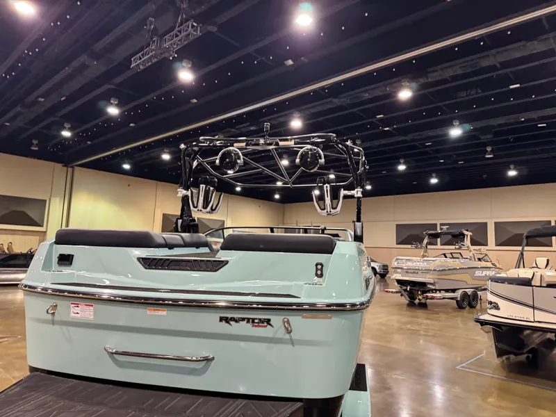 Slide: The Image of 2025 Moomba Max boat displayed indoors with sleek design and advanced features. - 9