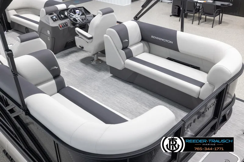 Slide: The Image of 2025 Bennington 22 SSRSE pontoon boat interior with luxurious seating and modern dashboard. - 11