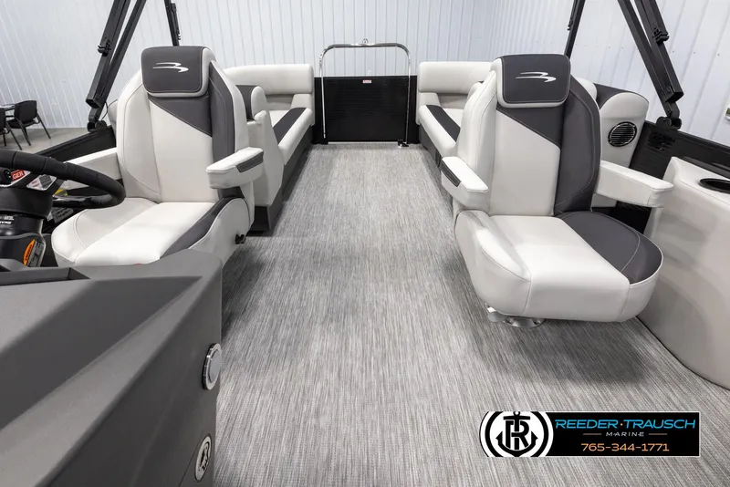 Slide: The Image of 2025 Bennington 22 SSRSE pontoon boat interior with modern seating and steering wheel. - 14