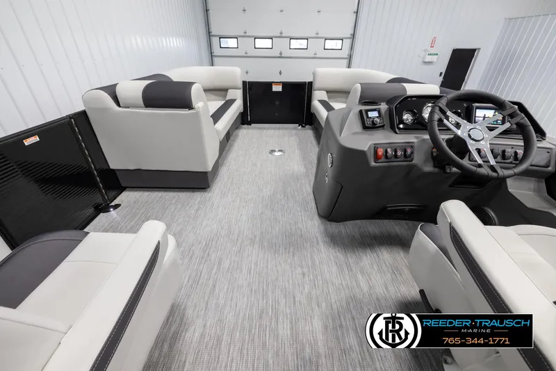 Slide: The Image of Interior of 2025 Bennington 22 SSRSE pontoon boat with modern seating and control panel. - 18