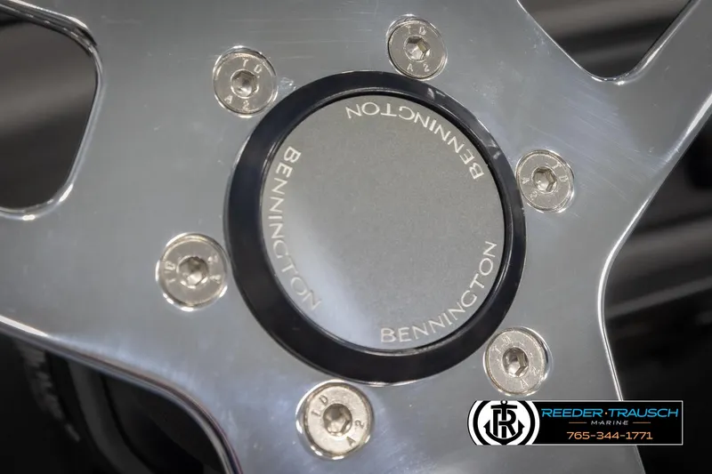 Slide: The Image of Close-up of 2025 Bennington 22 SSRSE steering wheel with logo and bolts. - 26