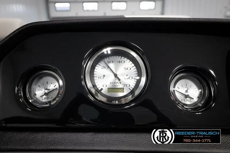 Slide: The Image of Dashboard gauges of a 2025 Bennington 22 SSRSE boat, featuring RPM, trim, and fuel indicators. - 29