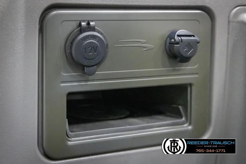 Slide: The Image of 12V marine power outlet on 2025 Bennington 22 SSRSE boat dashboard. - 32