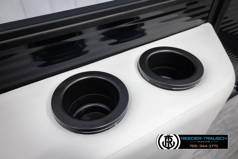 Slide: The Image of Cup holders on a 2025 Bennington 22 SSRSE boat, featuring sleek black and white design. - 37