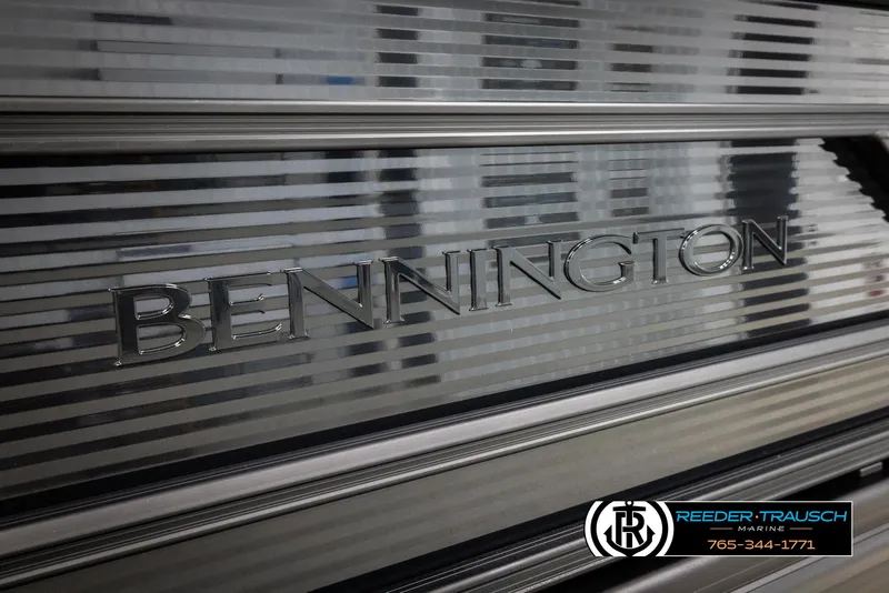 Slide: The Image of 2025 Bennington 22 SSRSE boat with sleek metallic design and Reeder-Trausch Marine logo. - 41