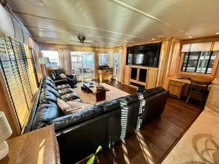 Slide: The Image of Luxurious interior of 2005 Sumerset 90x18 houseboat with leather seating and large TV. - 23