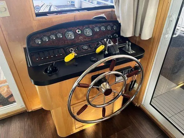 Slide: The Image of Helm of 2005 Sumerset 90x18 houseboat with steering wheel and control panel. - 27