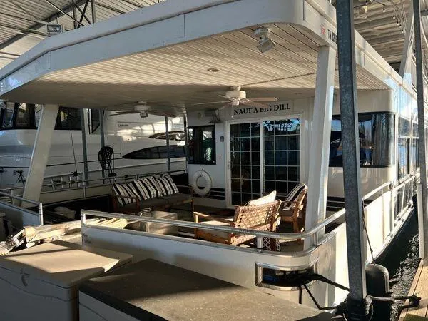 Slide: The Image of 2005 Sumerset 90x18 houseboat with outdoor seating and covered deck area. - 3