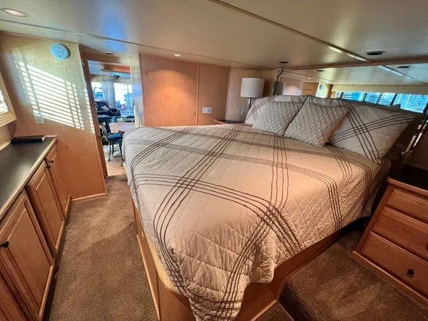 Slide: The Image of Luxurious bedroom interior of a 2005 Sumerset 90x18 houseboat with cozy bedding. - 34