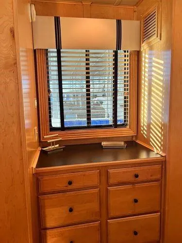 Slide: The Image of 2005 Sumerset 90x18 interior with wooden drawers and window blinds. - 44