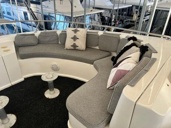Slide: The Image of 2005 Sumerset 90x18 houseboat with cozy outdoor seating area and decorative cushions. - 7
