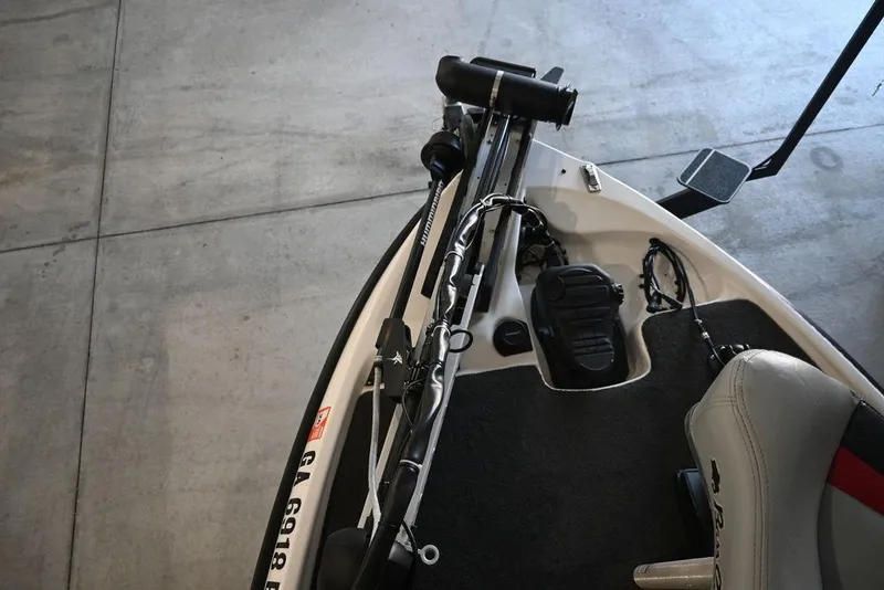 Slide: The Image of 2006 Bass Cat Puma boat deck with fishing equipment and seating. - 11