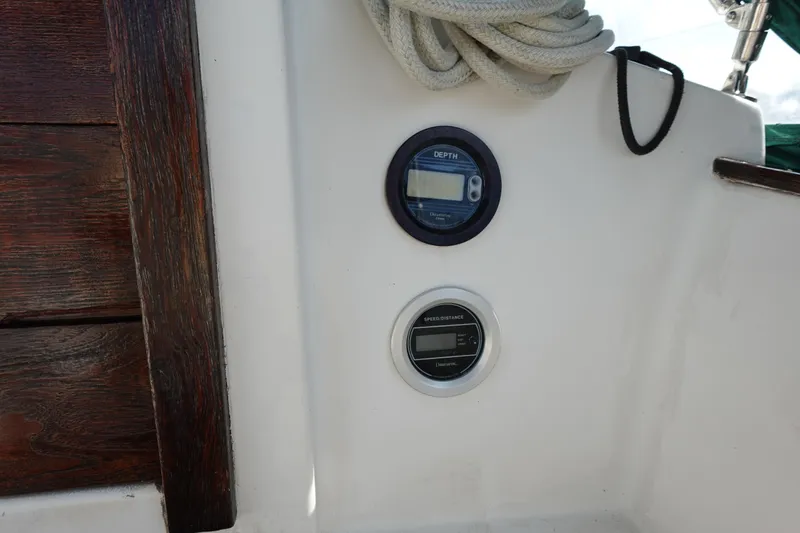 Slide: The Image of Control panel on 1982 Morgan 383 sailboat with depth gauge and rope. - 19