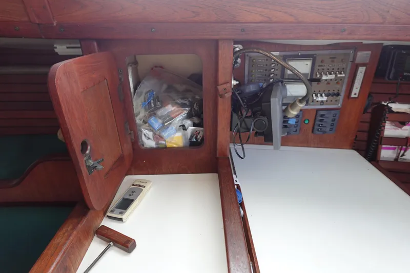 Slide: The Image of 1982 Morgan 383 yacht interior with navigation equipment and storage compartment. - 32