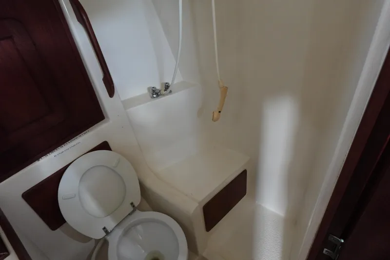 Slide: The Image of 1982 Morgan 383 yacht bathroom with toilet and shower area. - 44