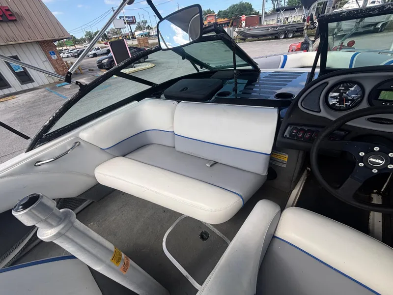 Slide: The Image of 2001 Malibu Response LX boat interior with white seating and dashboard view. - 18