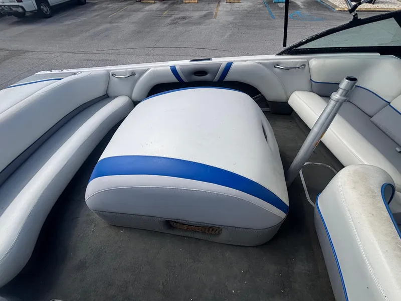 Slide: The Image of 2001 Malibu Response LX boat interior with white and blue seating. - 19
