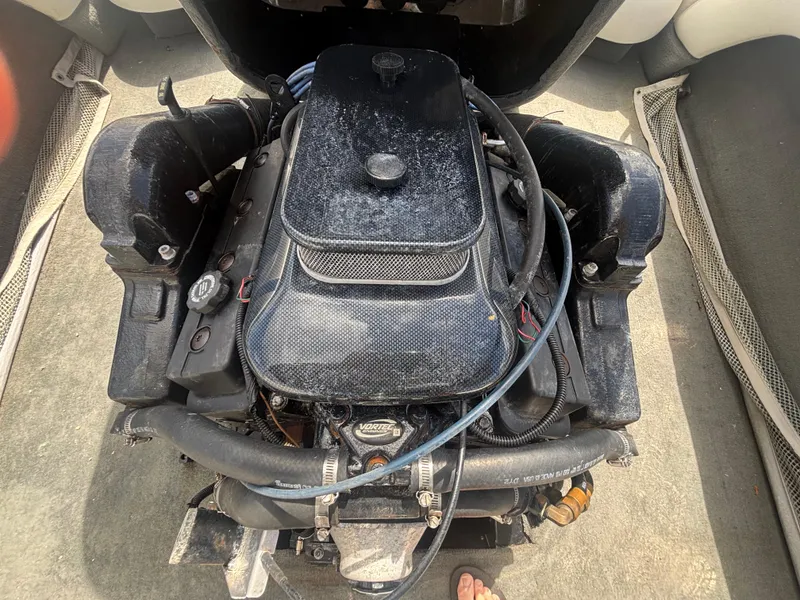 Slide: The Image of 2001 Malibu Response LX boat engine, top view, showing components and hoses. - 29