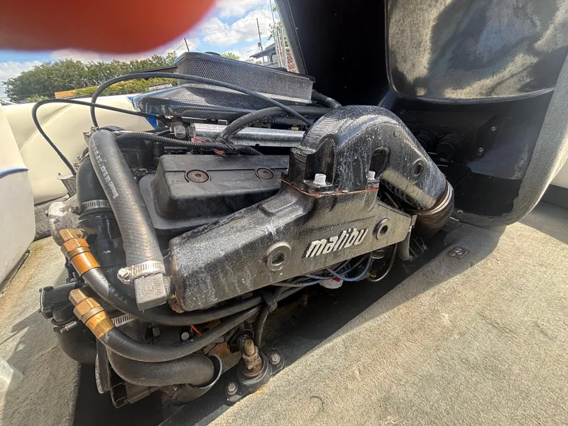 Slide: The Image of 2001 Malibu Response LX engine compartment with visible components and wiring. - 30