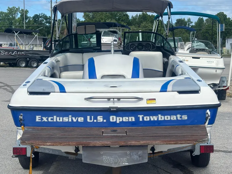 Slide: The Image of 2001 Malibu Response LX boat, "Exclusive U.S. Open Towboats" branding, parked on a trailer. - 9