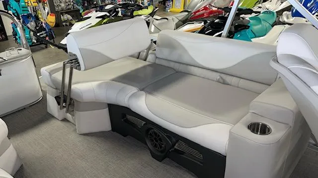 Slide: The Image of Luxurious seating on 2025 Tahoe LTZ 2385 QLS pontoon boat, featuring cup holders and sleek design. - 11