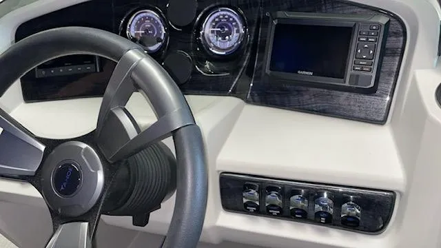 Slide: The Image of Steering wheel and dashboard of 2025 Tahoe LTZ 2385 QLS boat. - 8