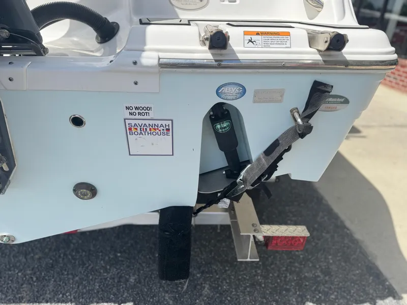 Slide: The Image of 2021 Sea Fox 228 Commander boat stern with safety labels and trailer attachment. - 4