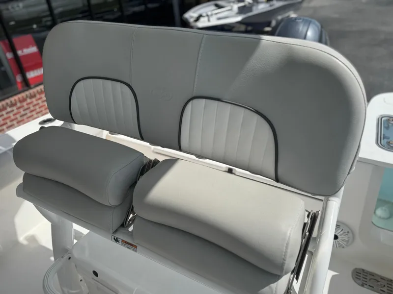 Slide: The Image of 2021 Sea Fox 228 Commander boat seat with cushioned backrest and armrests. - 9