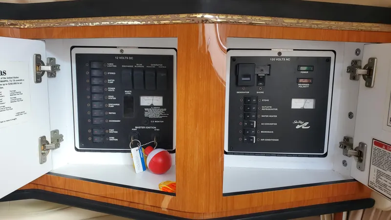 Slide: The Image of Electrical control panel on a 2001 Sea Ray 310 Sundancer boat. - 32