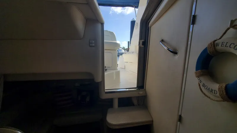 Slide: The Image of Interior view of 2001 Sea Ray 310 Sundancer yacht with open cabin door. - 39
