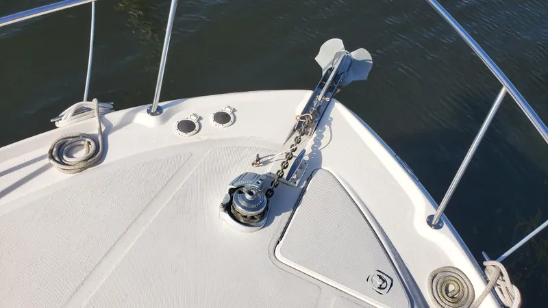 Slide: The Image of Bow of 2001 Sea Ray 310 Sundancer with anchor and railing. - 43