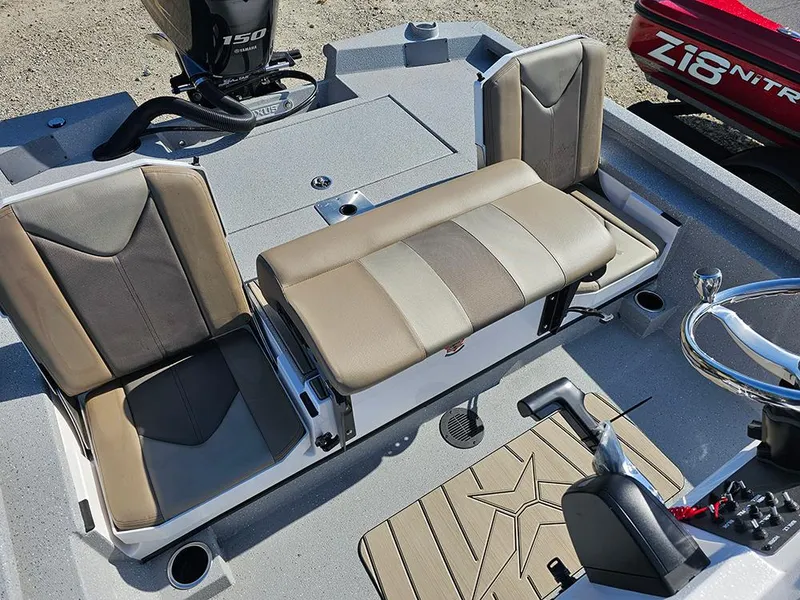 Slide: The Image of 2025 Vexus ACX 2000 boat interior with beige seating and steering wheel. - 10